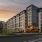 Exterior view of Aventon Huntington Station's community at dusk