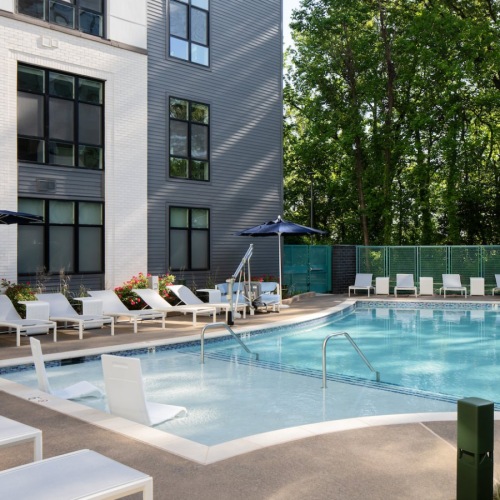 Three Bedroom Luxury Apartments in Alexandria VA - Aventon Huntington Station - Resort Style Pool with Sunshelf, Surrounding Sundeck with Lounge Seating, Umbrellas, Life Guard Chair and Lush Landscaping Three Bedroom Luxury Apartments in Alexandria VA - Aventon Huntington Station - Resort Style Pool with Sunshelf, Surrounding Sundeck with Lounge Seating, Umbrellas, Life Guard Chair and Lush Landscaping